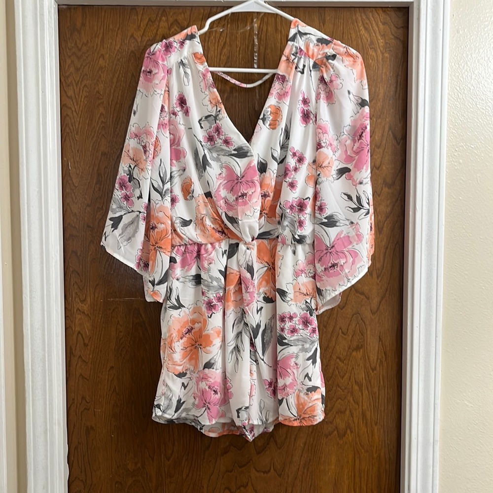 Romper, never worn. Tags attached